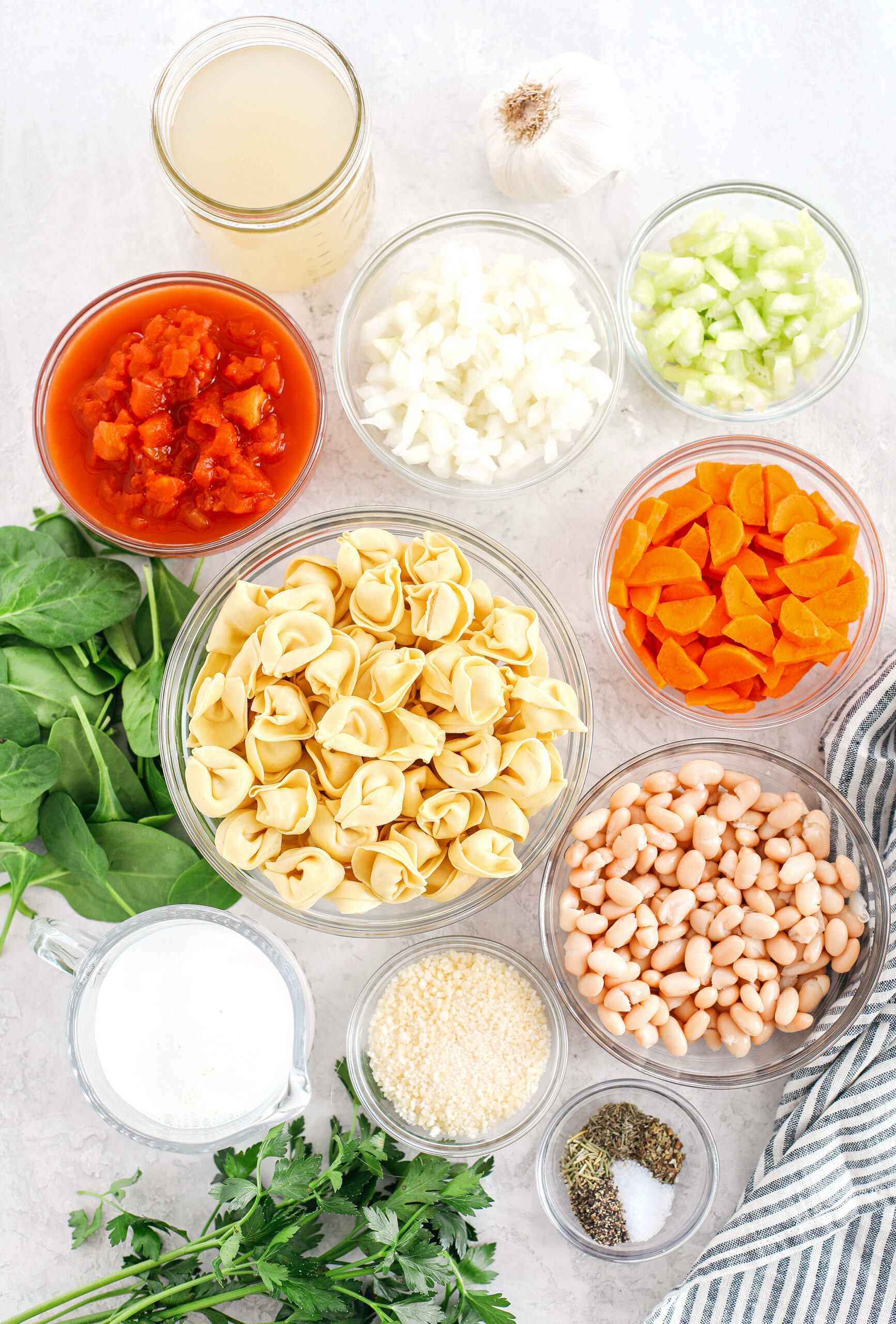 This Creamy Sausage & Spinach Tortellini Soup is delicious, loaded with veggies and makes the perfect cozy meal that can easily be made in your instant pot, slow cooker or right on the stove!