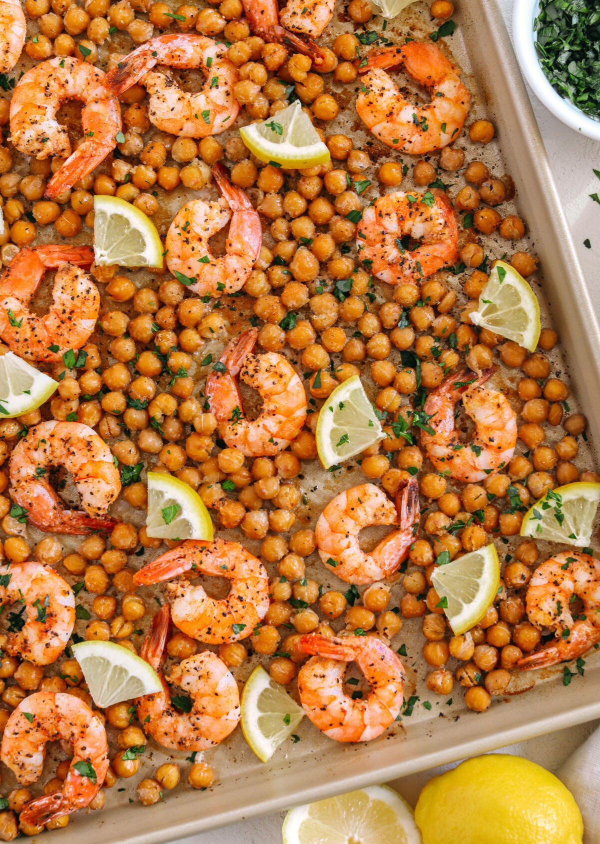 Flavorful Lemon Garlic Shrimp with Chickpeas easily made in under 30 minutes all on one pan with just a few simple ingredients!  Perfect as an appetizer, on top of a salad or even as a main dish!