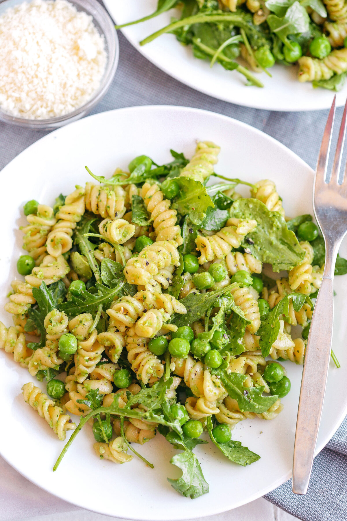 This light and fresh Pea and Arugula Pesto Pasta Salad is the perfect meal or side dish that is easy to make, healthy and delicious!